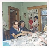 Dorothy and Clark Dooley in Gen Escher's dining room.  Niece Kay Cairns is holding the child.